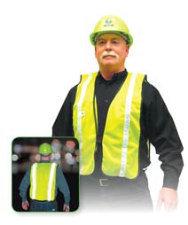 two construction workers wearing safty vests one orange vest one yellow vest reflective stripe construction site wearing hard hats