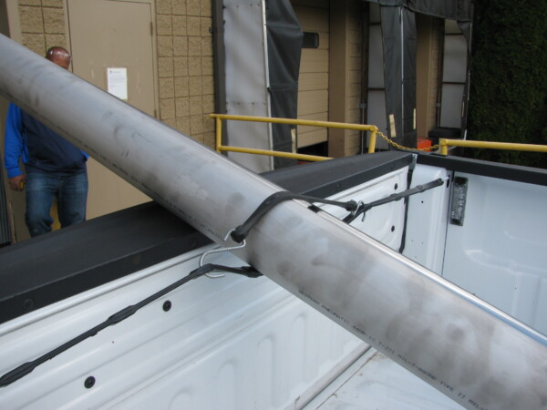 close up of adjustable straps in the back of a pick up truck