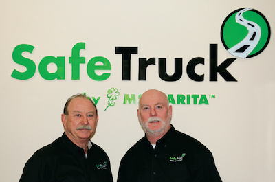 Gordon Mosby and Michael Mosby in front of a SafeTruck by Ms. Carita Logo