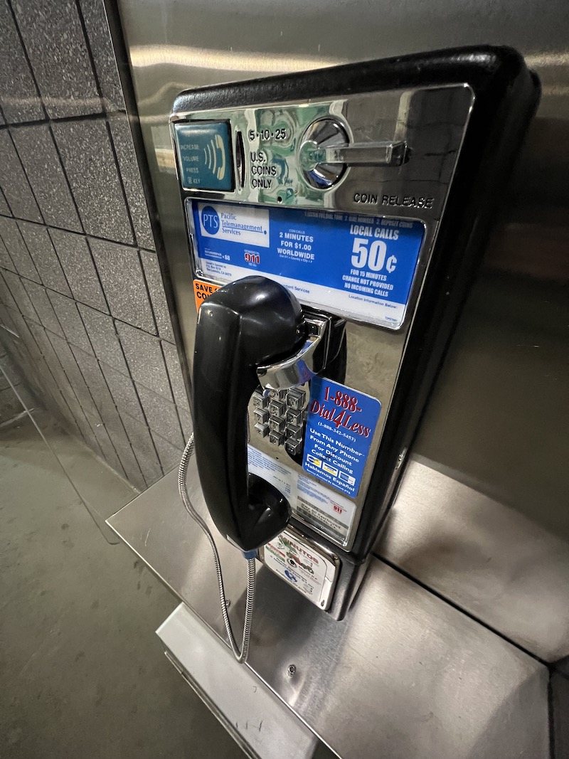 Pay Phone on a wall in a rest area