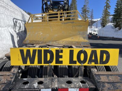 Wide Load Sign WIDE LOAD sign on the back of a trailer hauling a bulldozer