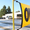 banner mount bracket on a flatbed trailer with a bungee oversize load banner