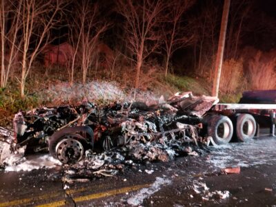 charred remains of the the truck next to the trailer